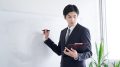 A Japanese male businessman practicing his presentation