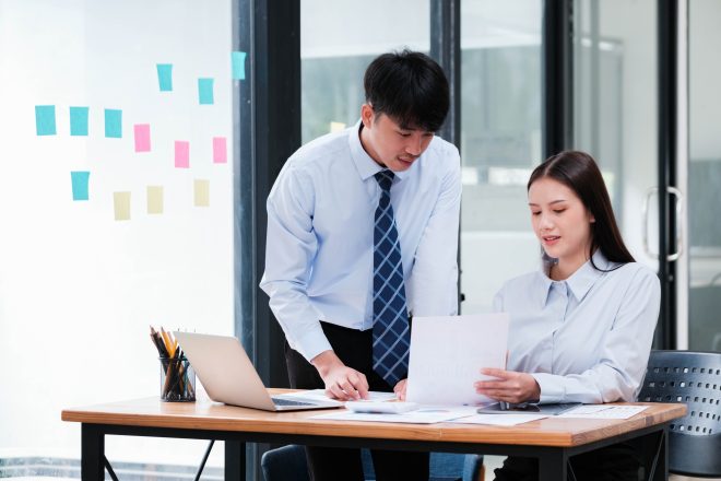 Business Team Engaged in Strategic Planning at Desk